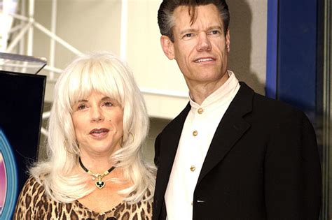 how old is randy travis first wife